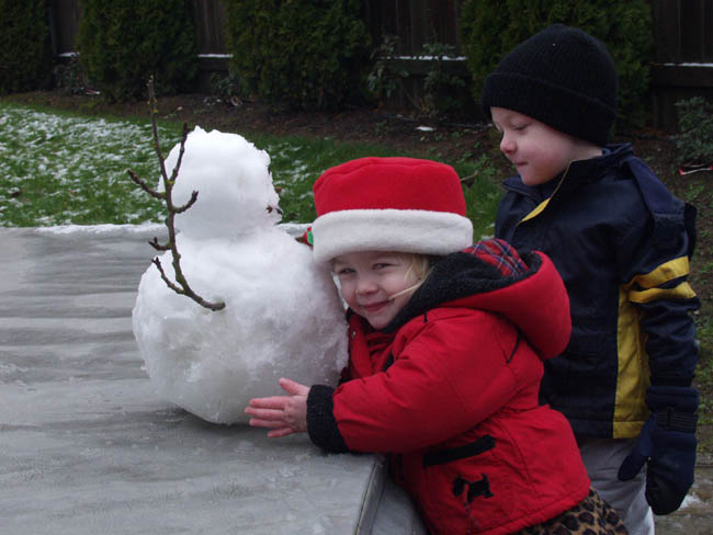 Emily Hugging First Snowman