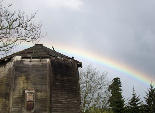 Rainbow over old building