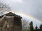 Rainbow over old building